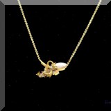 J032. 14K yellow gold and mother-of-pearl dragon necklace. 16” - $165